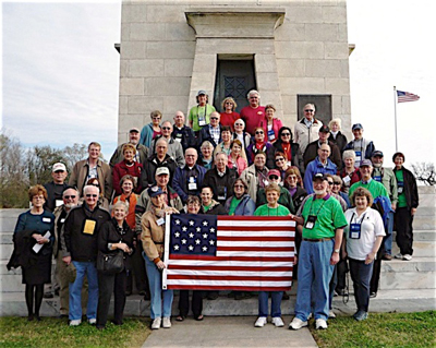 Group photo in front of a monument